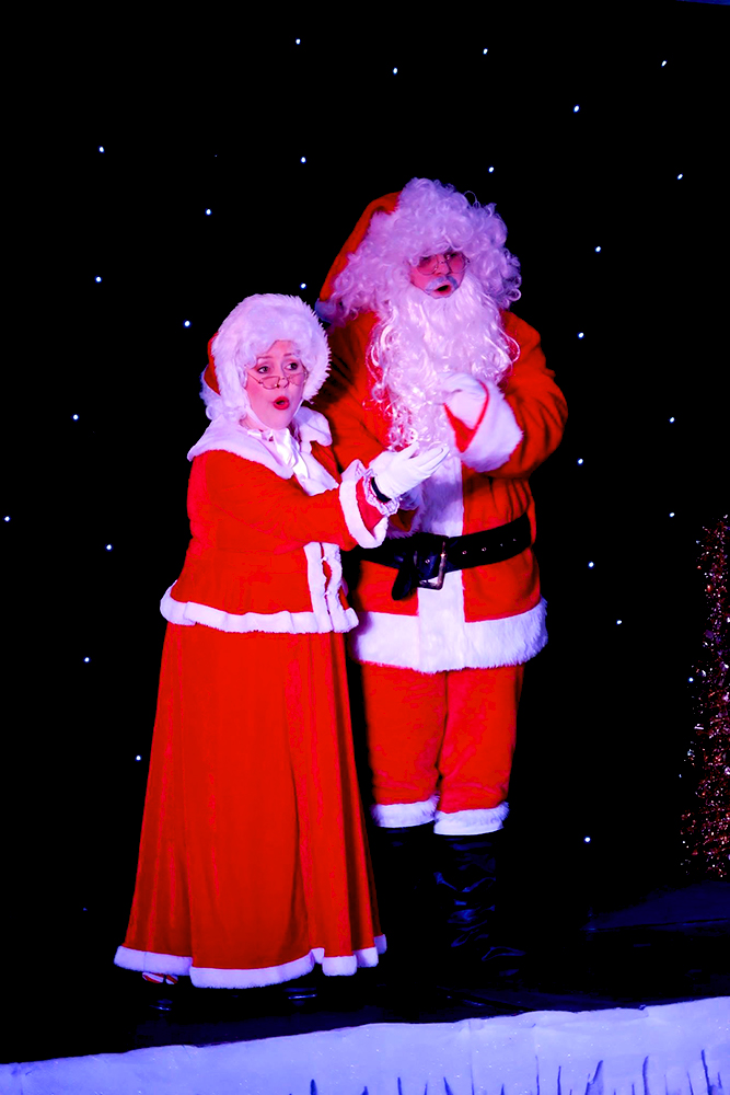 Mr and Mrs Santa on stage as part of the Nine Lives Christmas Variety Show.