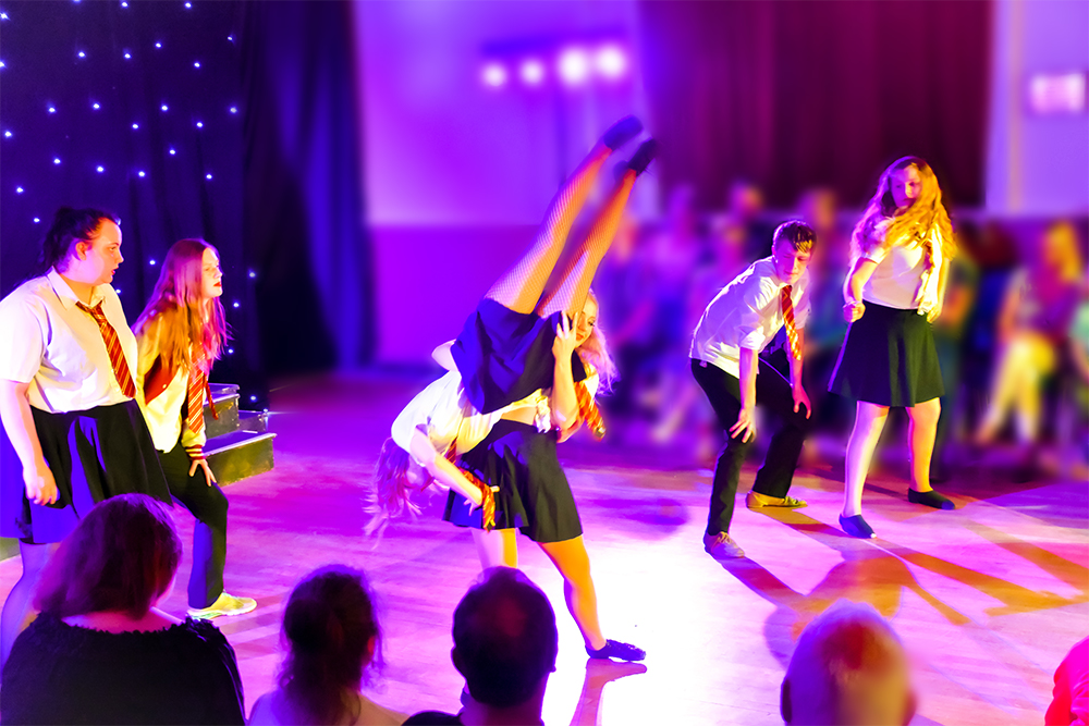 Dancers in Nine Lives Live in the middle of a lift.